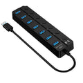 Black 7-port USB 3.0 hub with external power adapter for desktop and laptop computers.