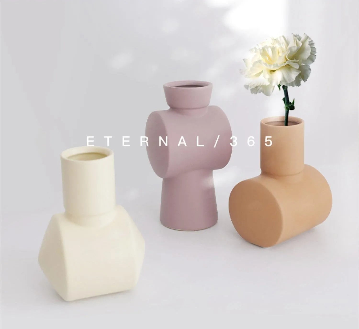A beige hammer-textured ceramic vase for Nordic home decoration.