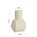 A beige hammer-textured ceramic vase for Nordic home decoration.
