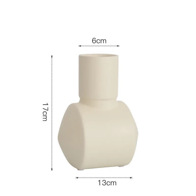 A beige hammer-textured ceramic vase for Nordic home decoration.
