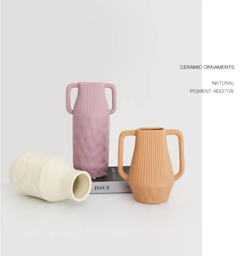 A beige hammer-textured ceramic vase for Nordic home decoration.