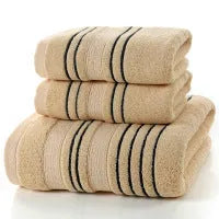 Cotton towel set showing white, grey and khaki bath towels with 34x74cm and 70x140cm dimensions