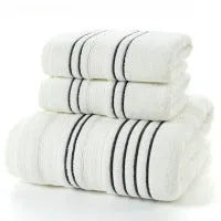 Cotton towel set showing white, grey and khaki bath towels with 34x74cm and 70x140cm dimensions