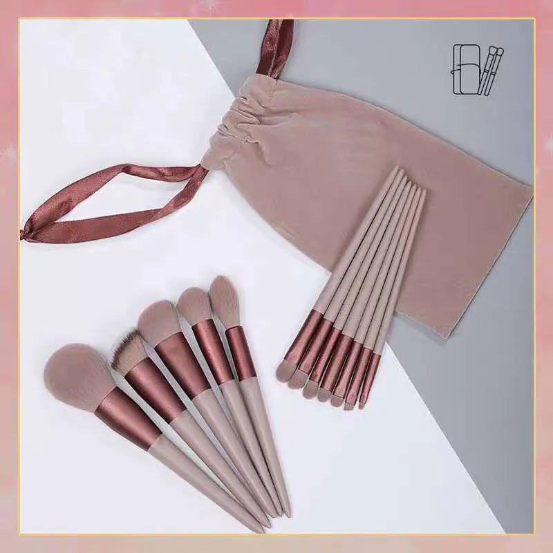 Thirteen Morandi green makeup brushes laid out, including blush and powder brushes