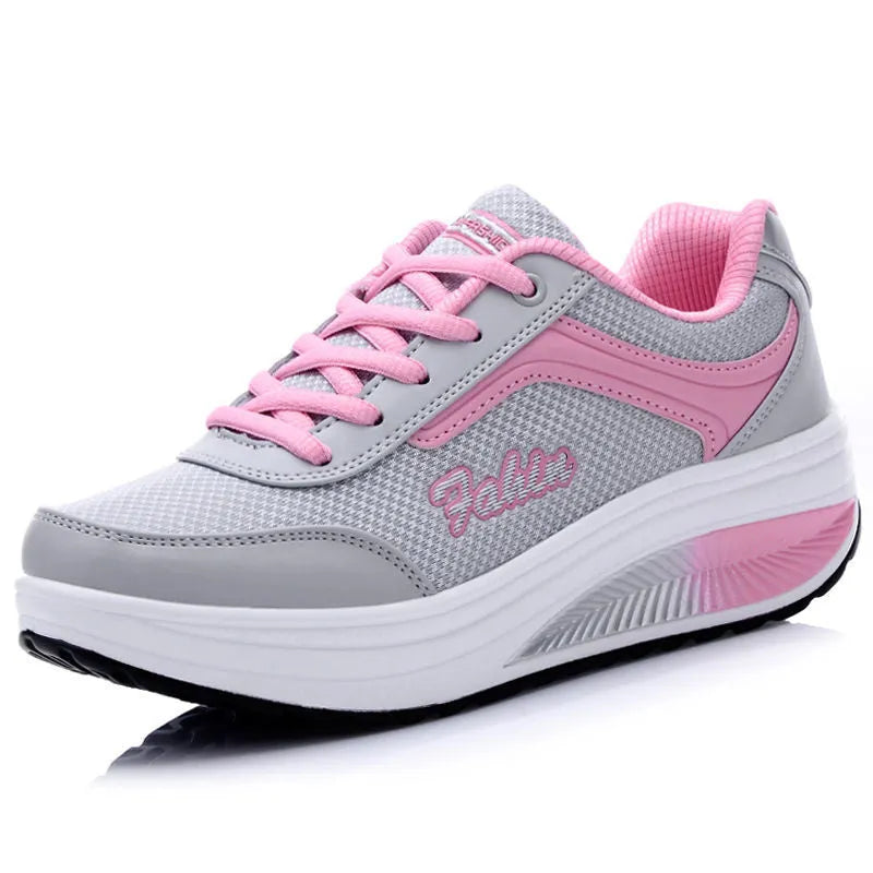 Women's mid-heel sports travel shoes in grey powder colour showing heelless design and single shoe construction
