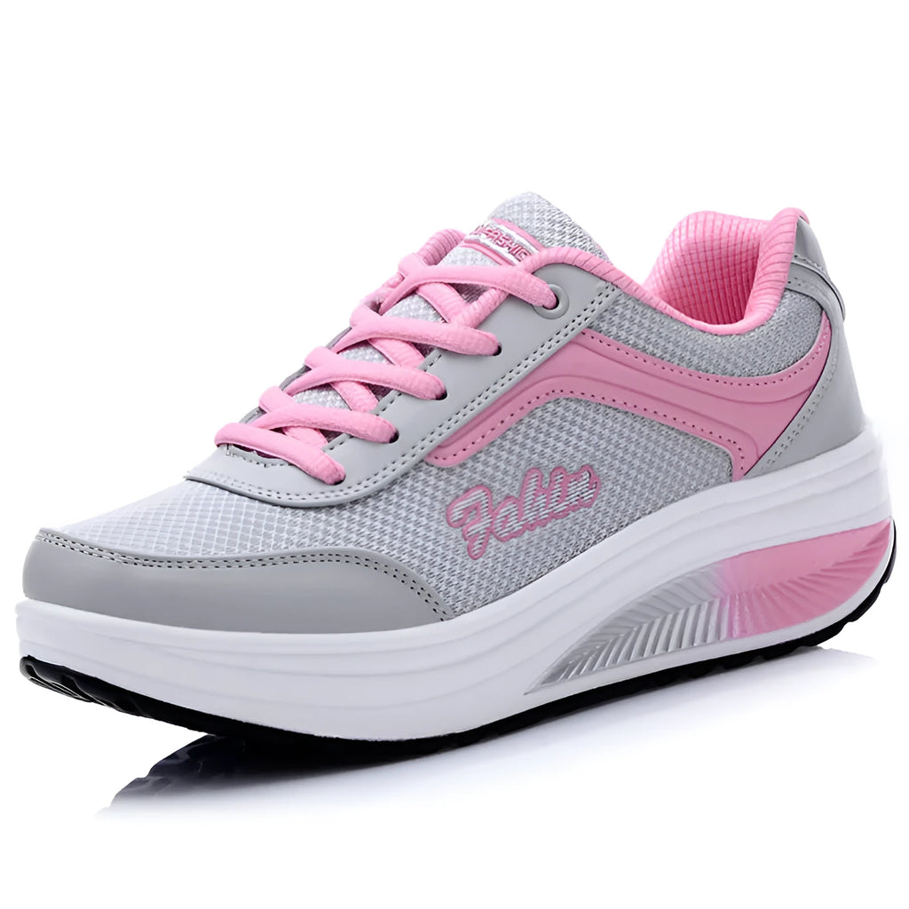 Women's mid-heel sports travel shoes in grey powder colour showing heelless design and single shoe construction