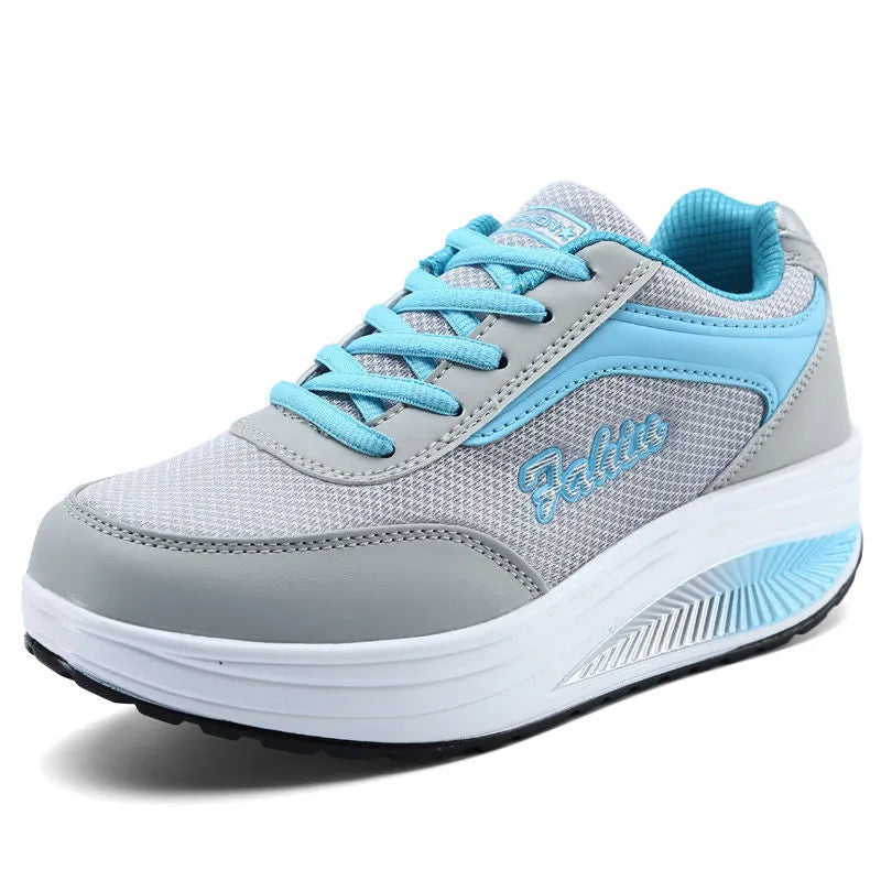 Women's mid-heel sports travel shoes in grey powder colour showing heelless design and single shoe construction