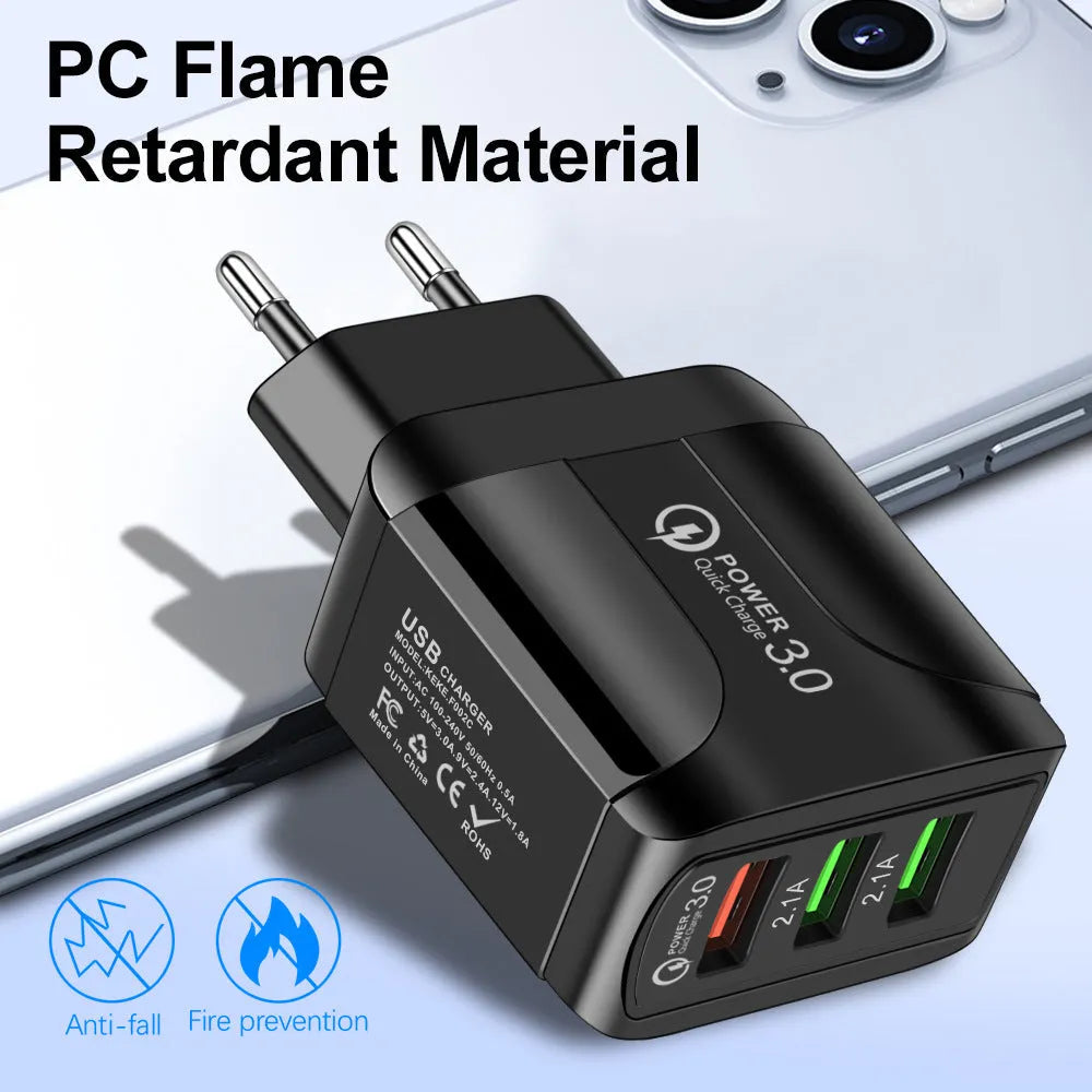 Quick Charge 3.0 travel charger with three USB ports and interchangeable US, EU, UK plug heads