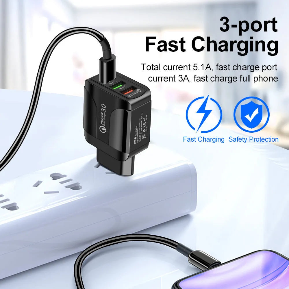 Quick Charge 3.0 travel charger with three USB ports and interchangeable US, EU, UK plug heads
