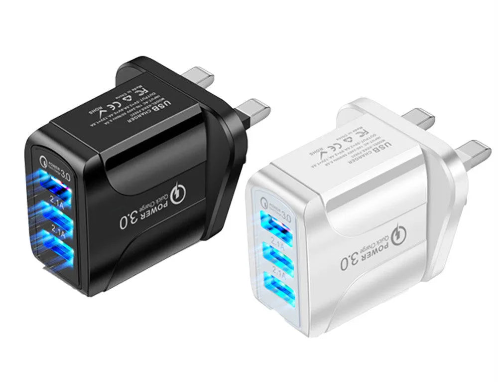 Quick Charge 3.0 travel charger with three USB ports and interchangeable US, EU, UK plug heads
