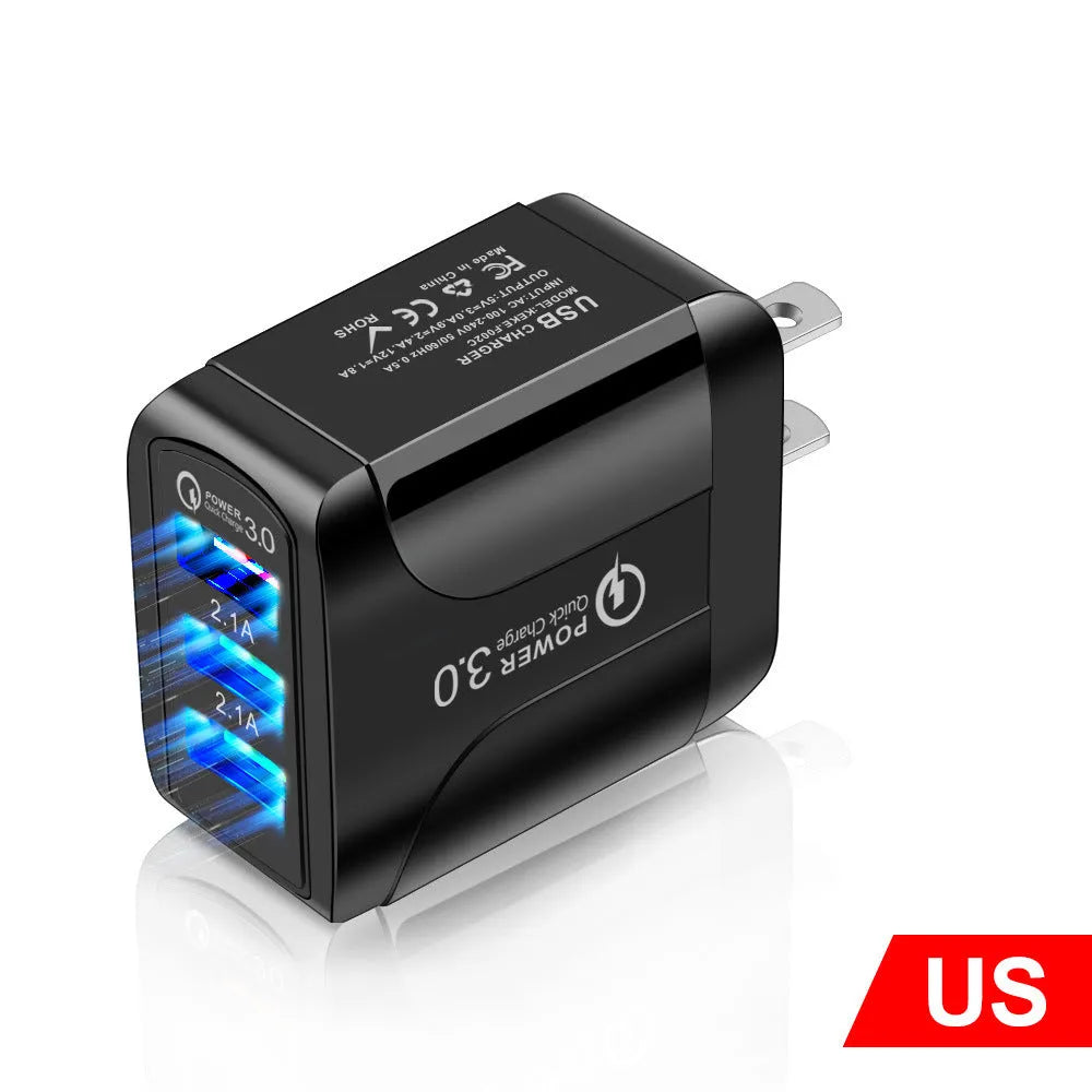 Quick Charge 3.0 travel charger with three USB ports and interchangeable US, EU, UK plug heads