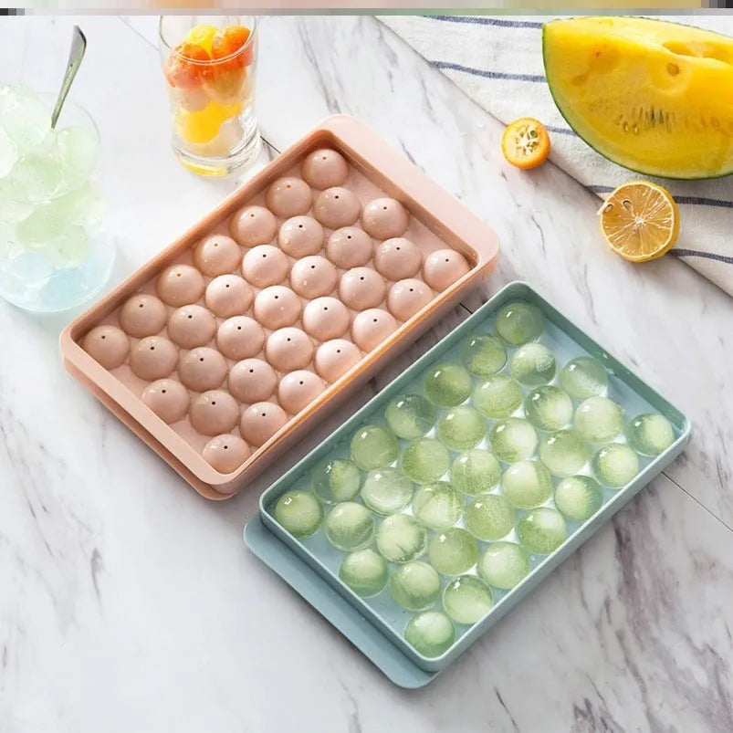 Sky blue round ball ice cube mould with 18 spherical cavities on a kitchen counter