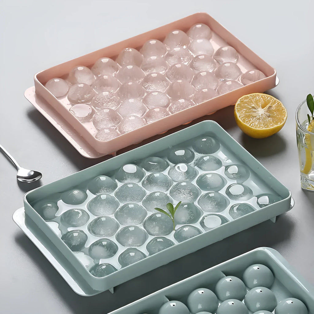 Sky blue round ball ice cube mould with 18 spherical cavities on a kitchen counter