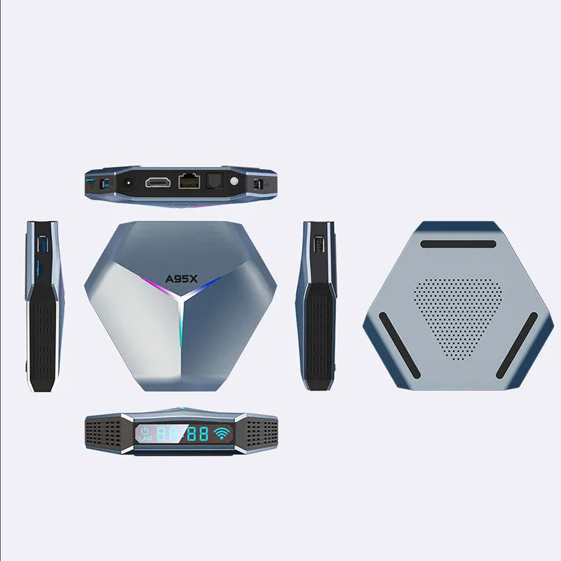 Android TV set-top box media player with remote control on a wooden surface.