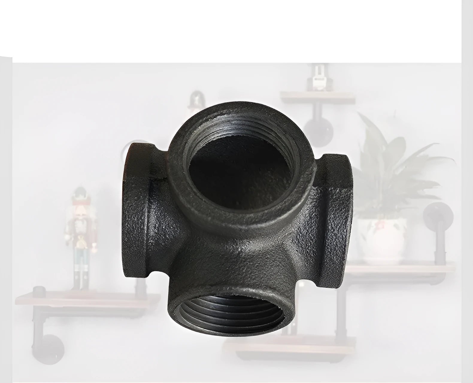 Galvanised steel four-way pipe fitting with three-dimensional corner design for industrial plumbing connections
