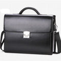 Black horizontal square men's PU leather briefcase with a zip opening and hand grip.