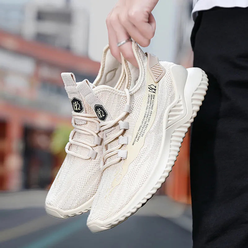 Men's white mesh casual sports shoes with a rubber sole and round toe on a plain background