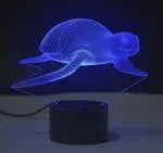 Small 3D acrylic table lamp with colourful LED lights on a square black base