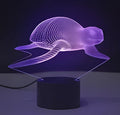 Small 3D acrylic table lamp with colourful LED lights on a square black base