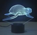 Small 3D acrylic table lamp with colourful LED lights on a square black base