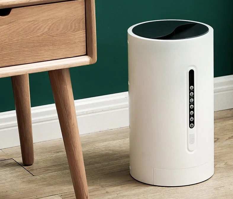 White automatic smart pet feeder with digital timer and large food hopper on a kitchen counter.