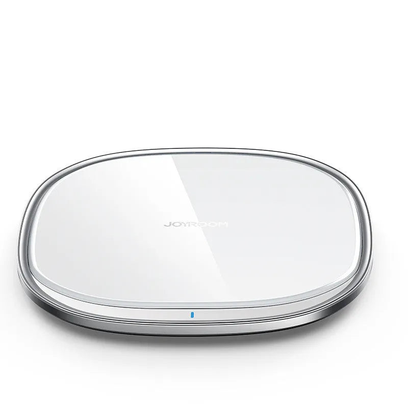 Square black 15W wireless phone charger with a glass top and zinc alloy frame on a desk.