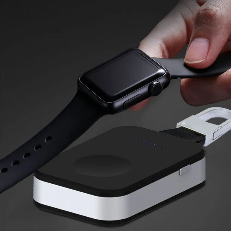 Black portable Apple Watch wireless charger power bank on a keychain.