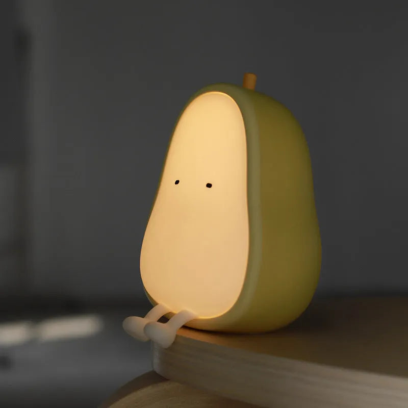 Warm yellow pear-shaped silicone bedside night light with USB charging