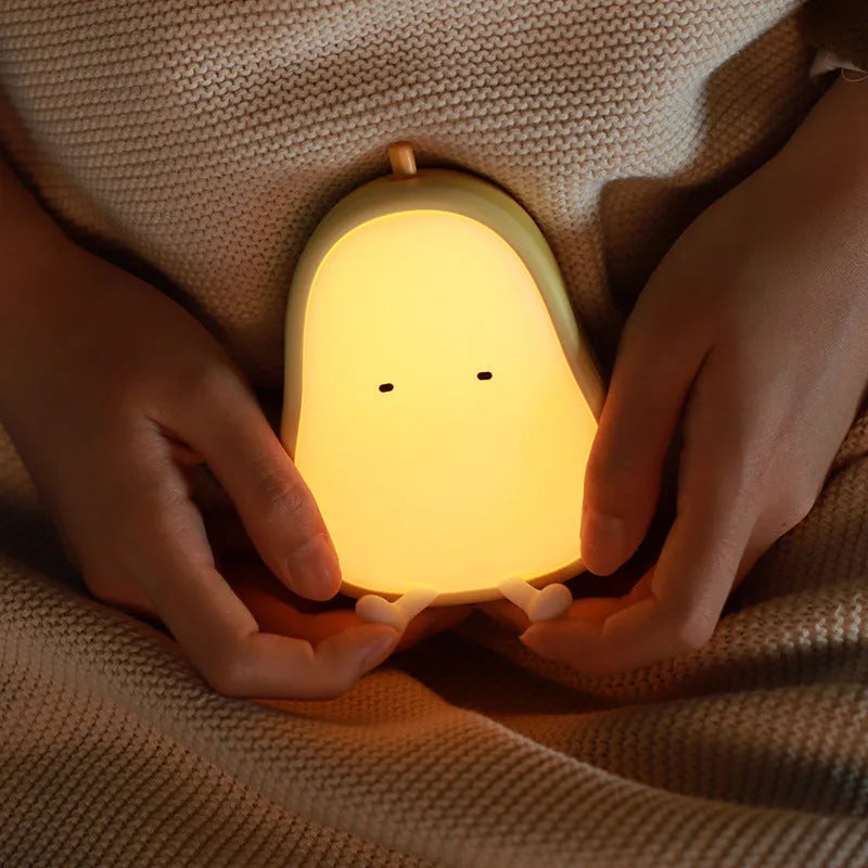 Warm yellow pear-shaped silicone bedside night light with USB charging