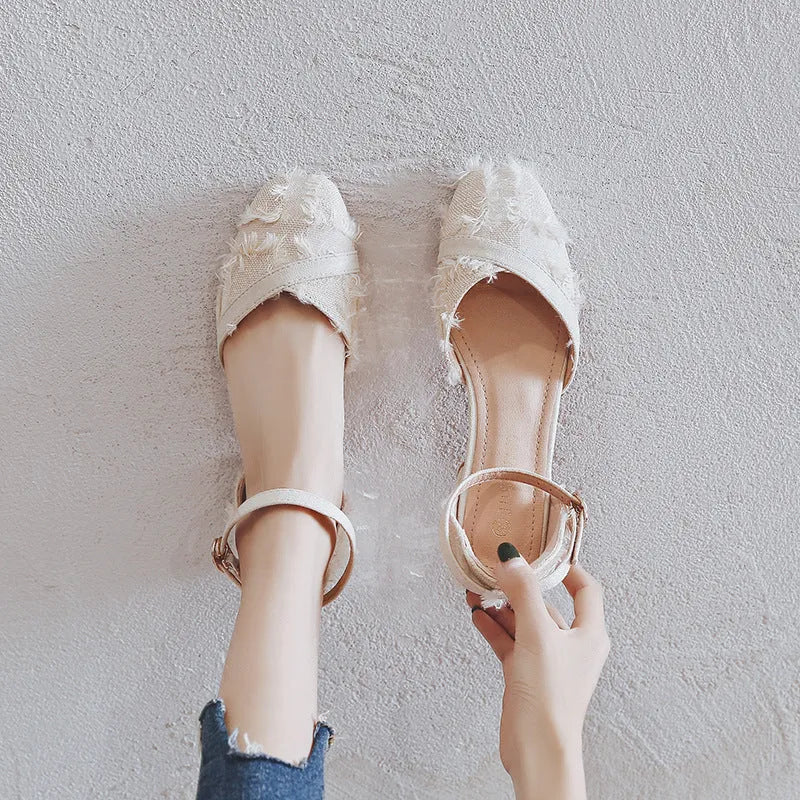 Apricot suede women's flats with an ankle strap and a low dorsay heel.