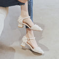 Apricot suede women's flats with an ankle strap and a low dorsay heel.