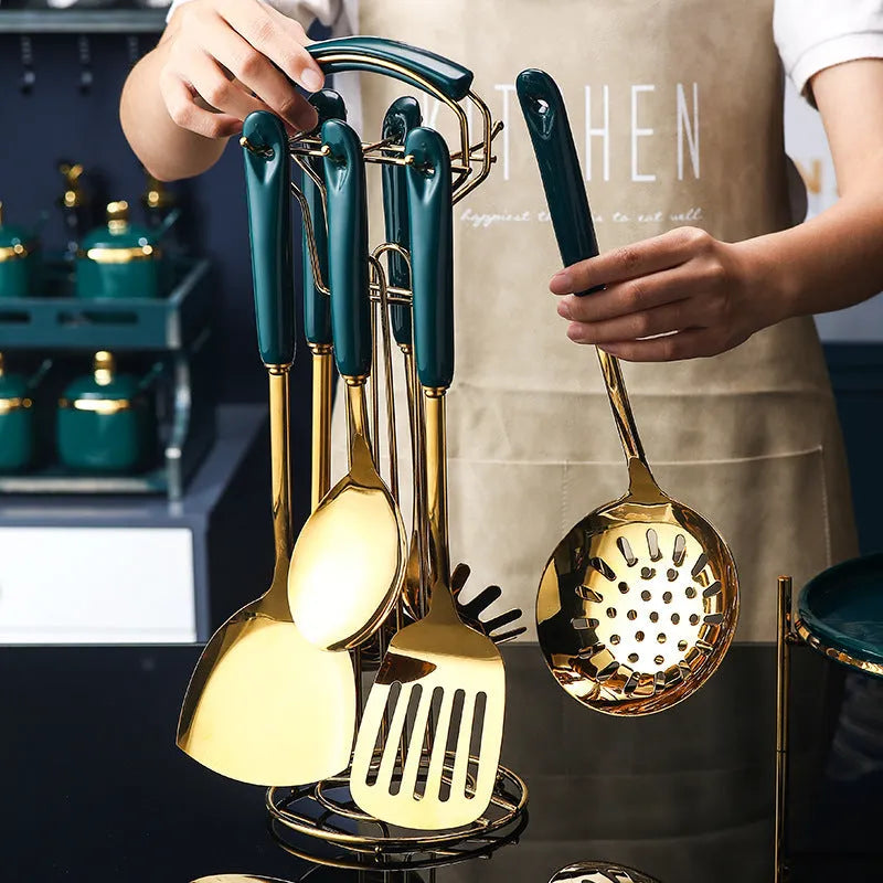 7-piece stainless steel kitchen utensil set with spatula, turner, ladle, serving spoon, and pasta server