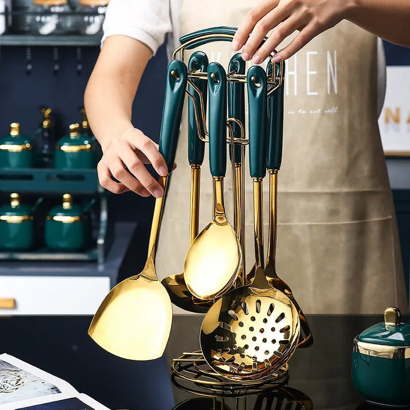 7-piece stainless steel kitchen utensil set with spatula, turner, ladle, serving spoon, and pasta server