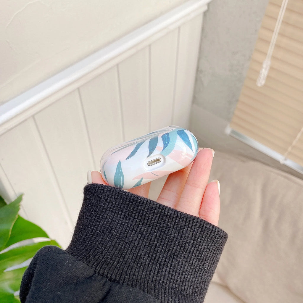 Blue TPU AirPods case with painted banana leaves tropical design