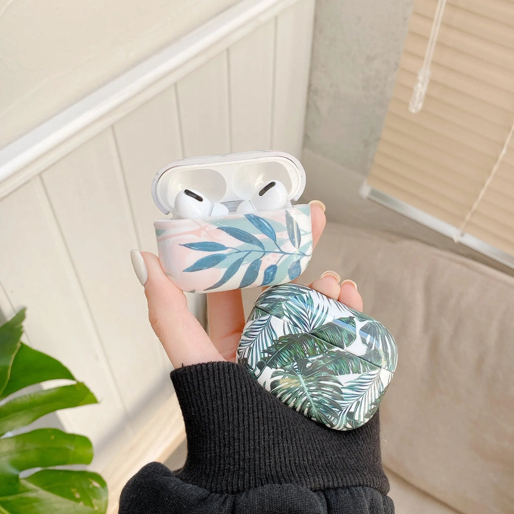 Blue TPU AirPods case with painted banana leaves tropical design