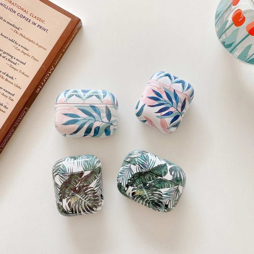 Blue TPU AirPods case with painted banana leaves tropical design