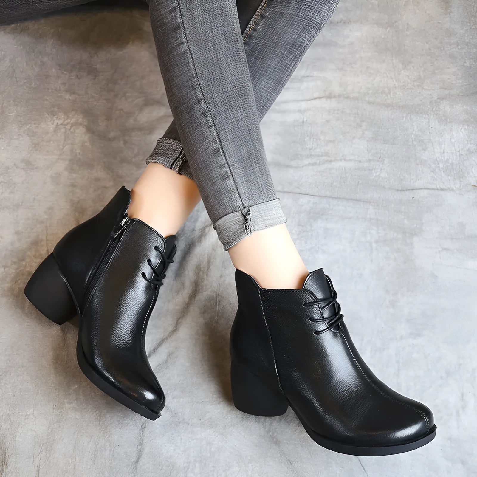 Women's brown leather Martin boots with a thick block heel and round toe on a white background.