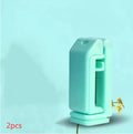 Black 360-degree rotating collapsible phone holder on desktop showing adjustable viewing angles