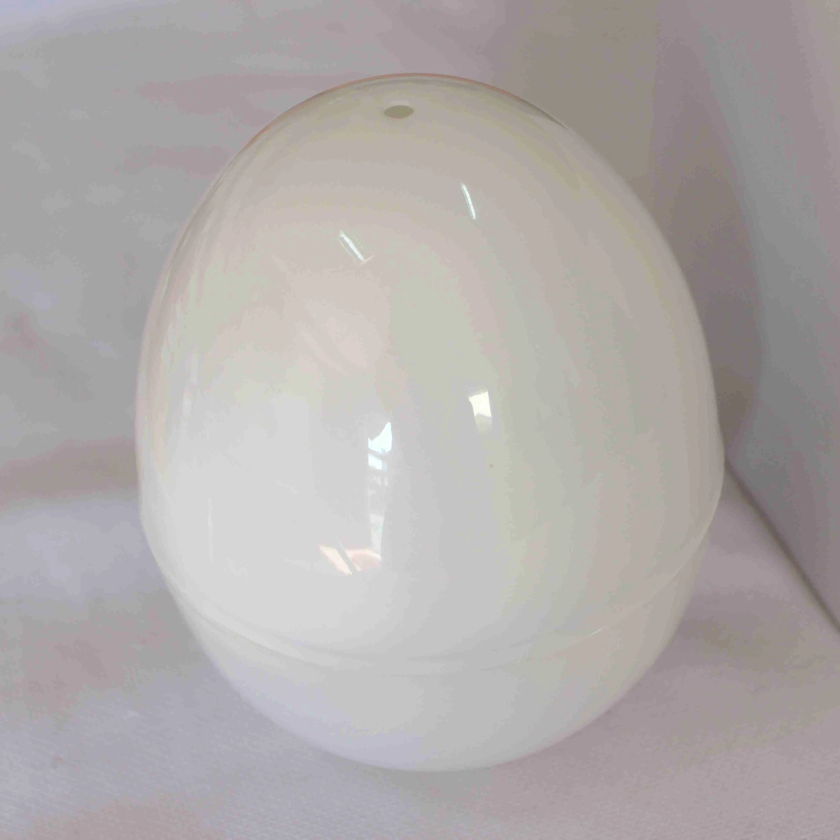 White microwave egg steamer cooker with capacity for four eggs.
