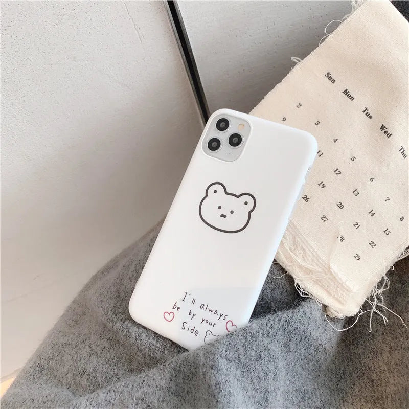 Silicone mobile phone case with a cartoon bear design for Apple iPhone models.