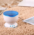 Blue ocean theme LED projection lamp for children's rooms on a wooden surface.