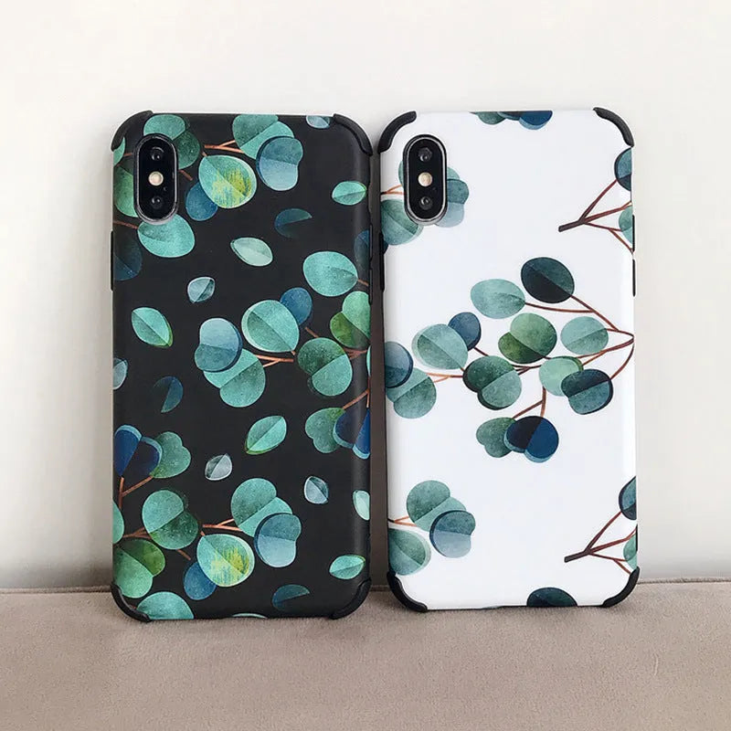 Black silicone iPhone case with a detailed leaf pattern design on the back.