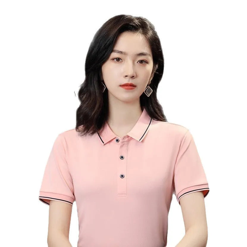 Short-sleeved beautician work polo shirt in light blue on a hanger.