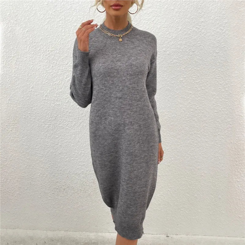Women's grey crew neck long sleeve acrylic pullover sweater laid flat.