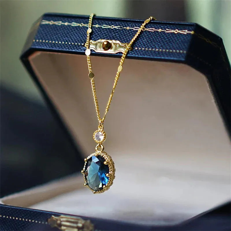 Gold geometric pendant on a French retro style copper chain necklace.