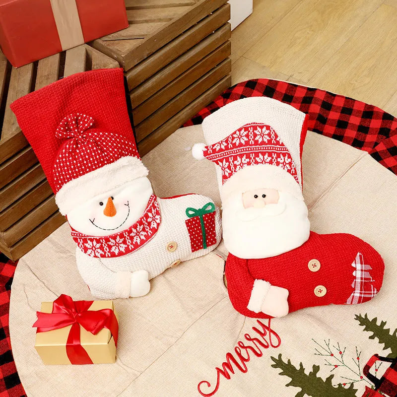Large red and white knitted Christmas stocking with Santa Claus design for fireplace decoration