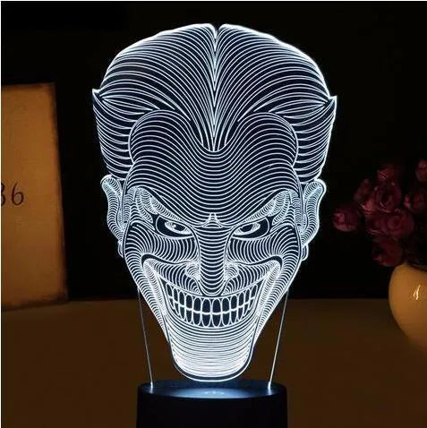 USB-powered 3D acrylic LED lamp displaying multiple colours, shown with its remote control and stand.