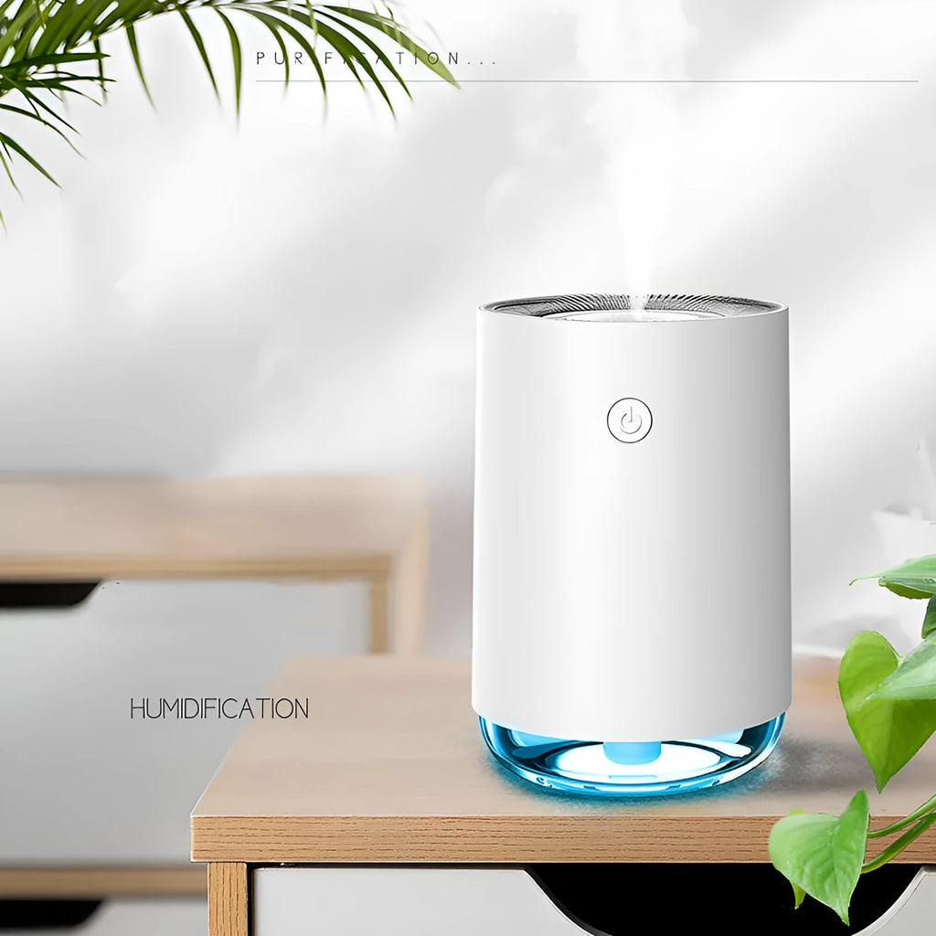 Green, pink, and white USB-powered humidifier diffuser with night light function on a wooden table.