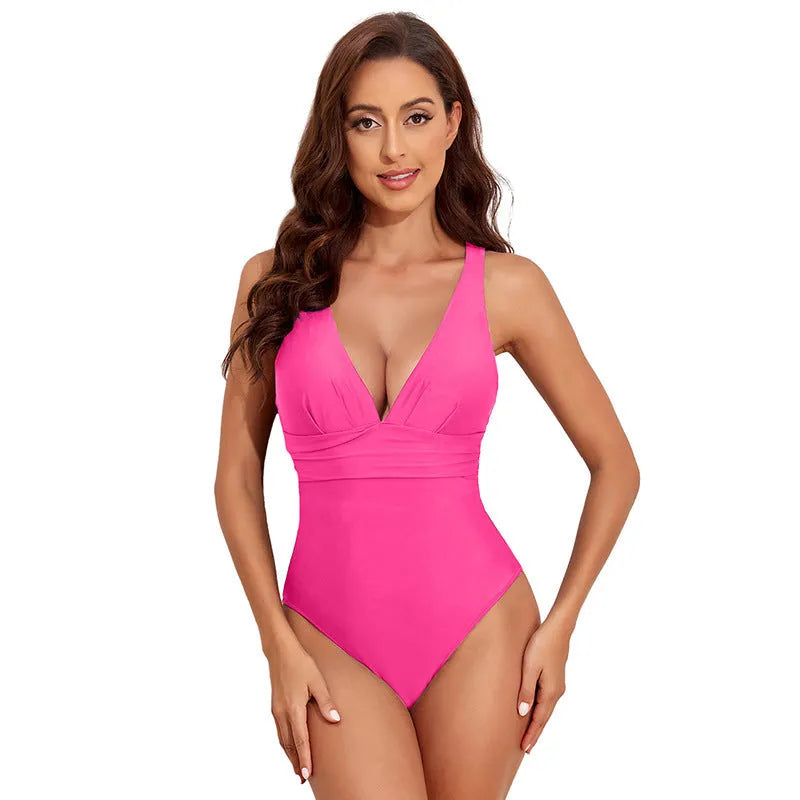 Women's solid colour cross-shoulder one-piece swimsuit in minimalist design for swimming activities