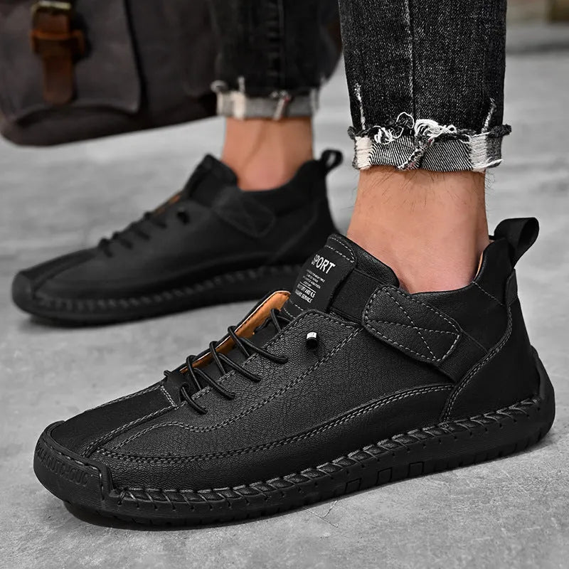 Men's round-toe mid-calf casual boot in black with visible tooling stitching detail on the microfiber upper.